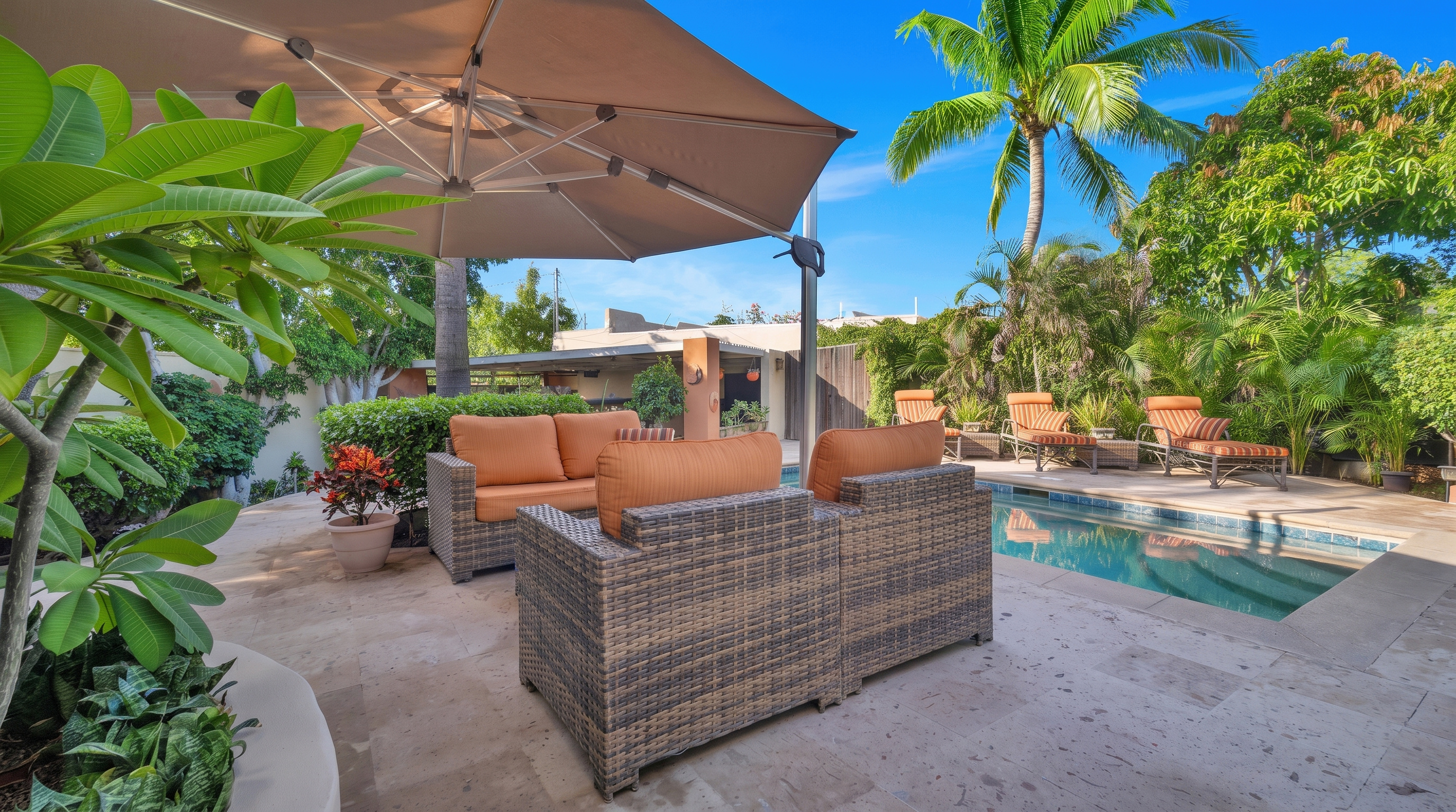 Shaded outdoor lounge beside the pool