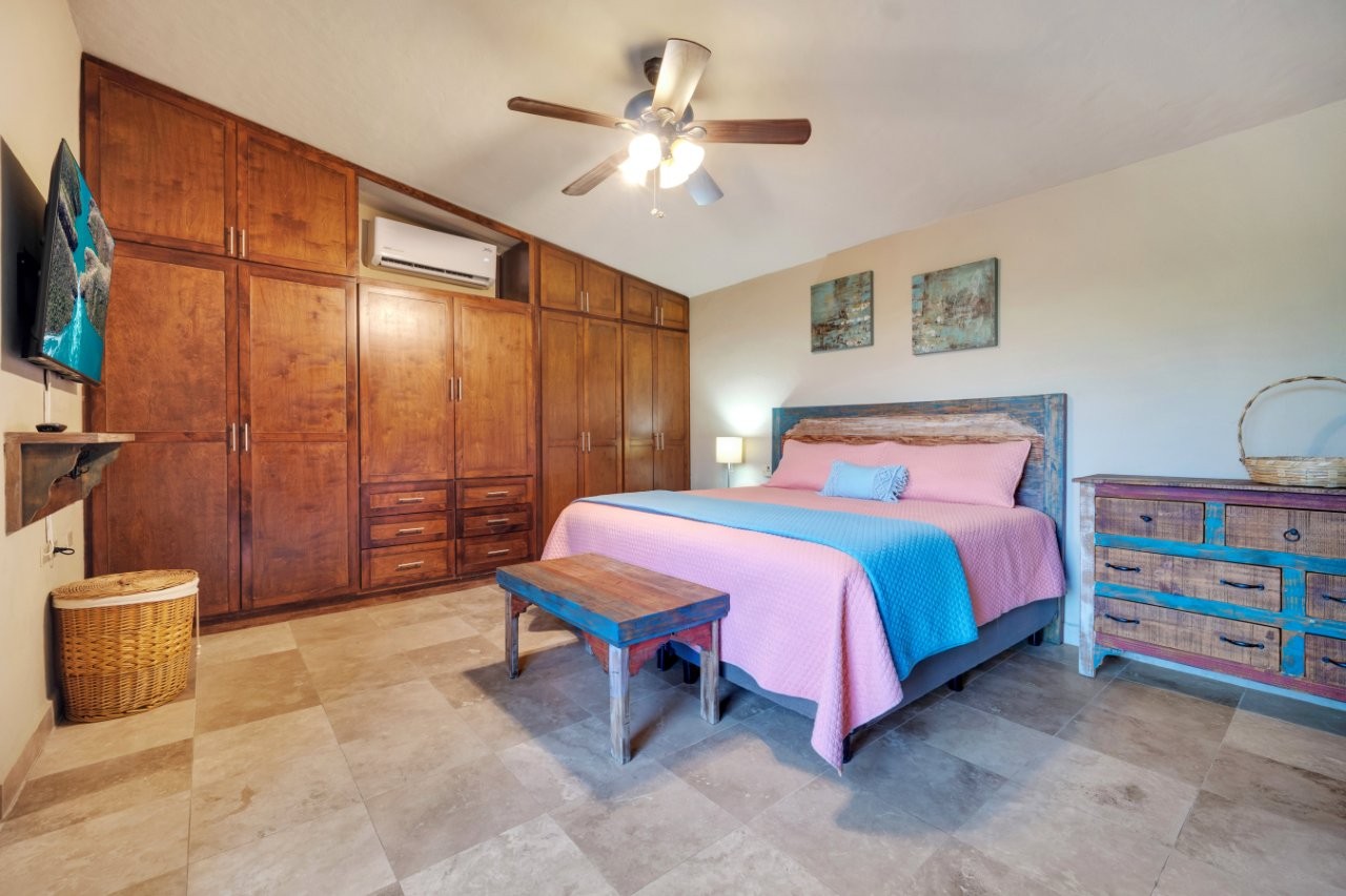 Bedroom with built-in wood cabinetry