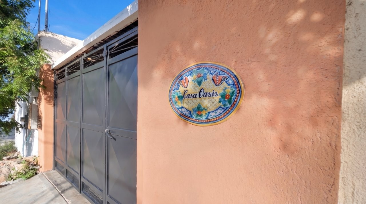 Private gate and Casa Oasis sign